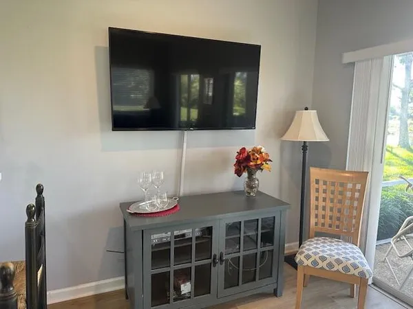 a dining room with furniture and window