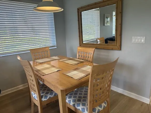 a dining room with furniture and window