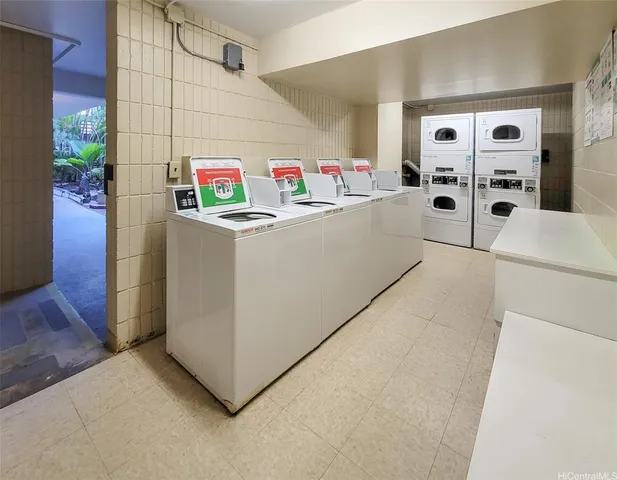 a vase with flowers sitting on a floor
