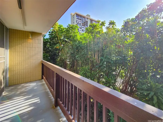 a view of a balcony with an outdoor space