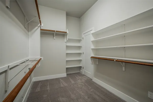 a view of an empty walk in closet