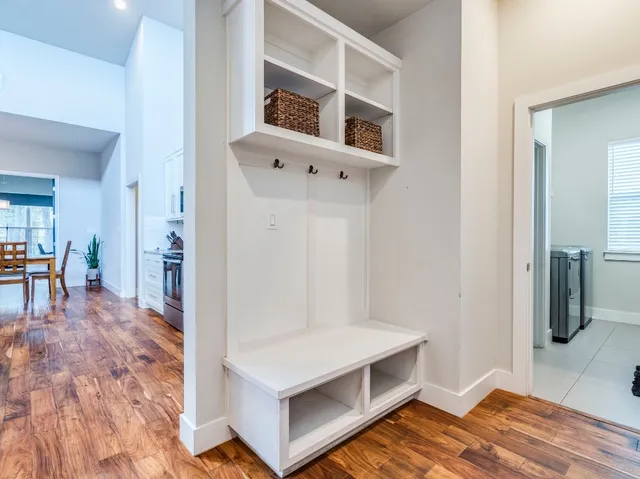 a view of kitchen and hall with wooden floor