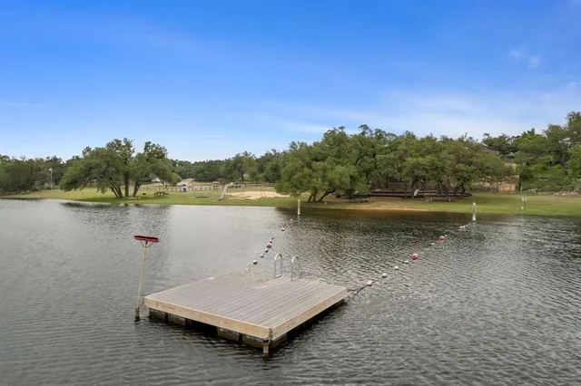 a view of a lake with houses in background