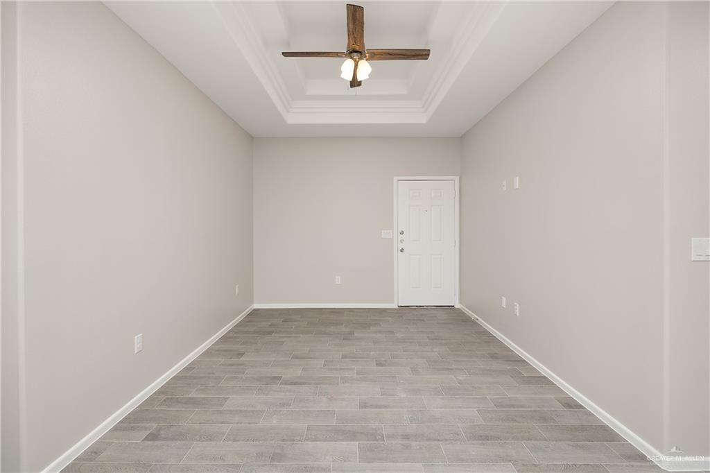 2808 West Harrison Avenue, Unit 4 Alton, TX 78573 - Photo 11 of 22 wooden floor in an empty room