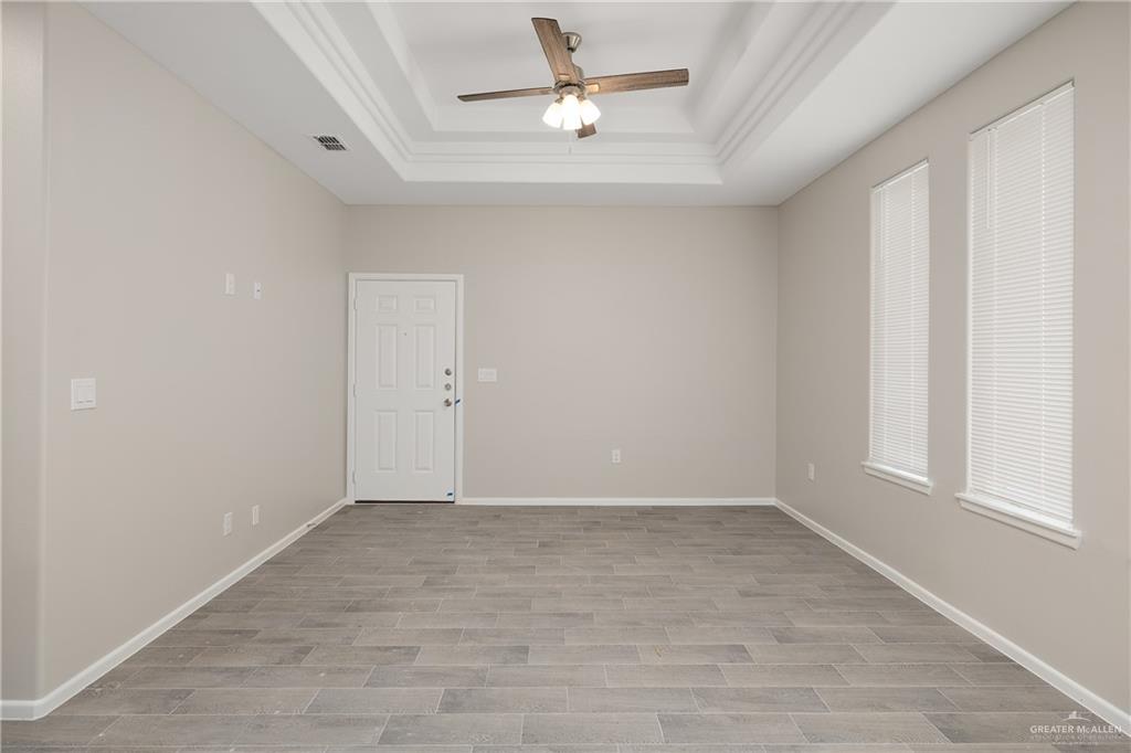 2808 West Harrison Avenue, Unit 4 Alton, TX 78573 - Photo 3 of 22 a view of an empty room with a window