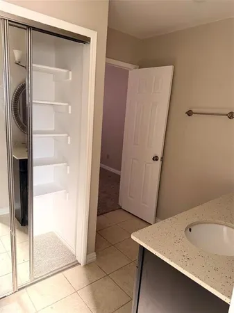 a bathroom with a sink and a shower