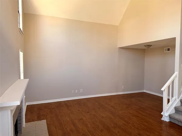 a view of small space with wooden floor and cabinet