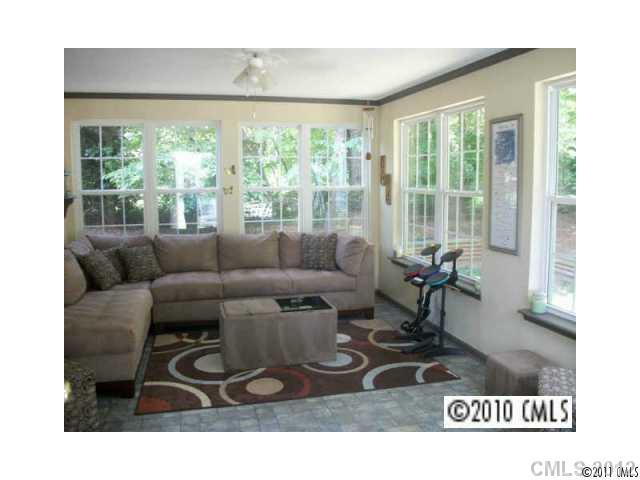 11901 Henderson Hill Road Huntersville, NC 28078 - Photo 3 of 4 a living room with furniture and a large window