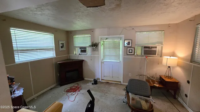 a bedroom with furniture and a window