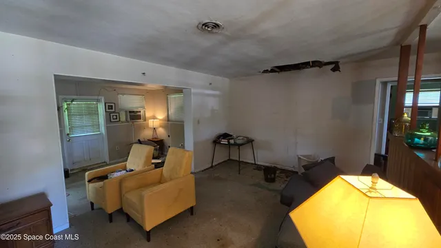 a bed room with a bed and a chair