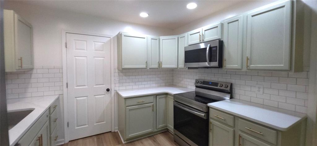 1774 Joe Black Road Sautee Nacoochee, GA 30571 - Photo 7 of 20 a kitchen with a sink and cabinets