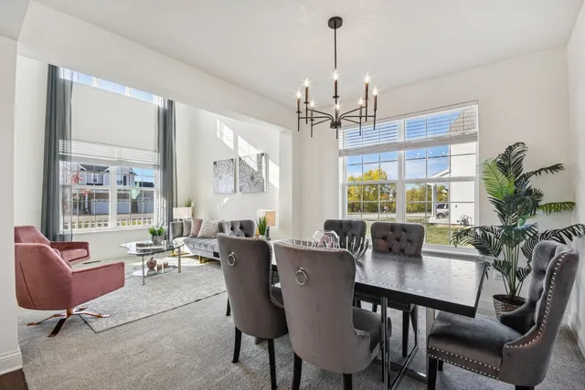 a view of a dining room with furniture window and outside view