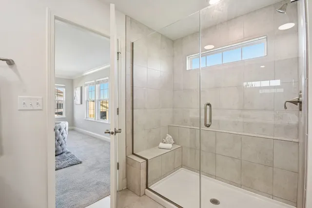 a bathroom with a glass shower door