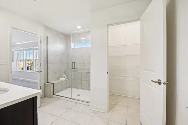 a bathroom with a shower and a sink