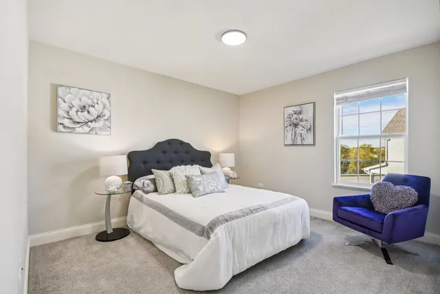 a bedroom with a bed and a couch