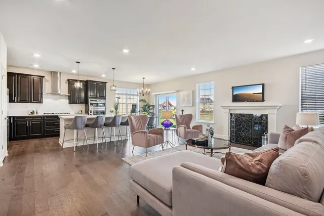 a living room with fireplace furniture and a flat screen tv