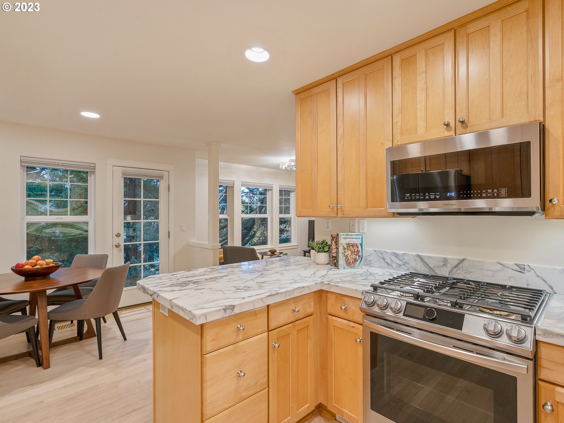2306 Northwest Miller Road Portland, OR 97229 - Photo 20 of 46 a kitchen with a stove a sink and a microwave