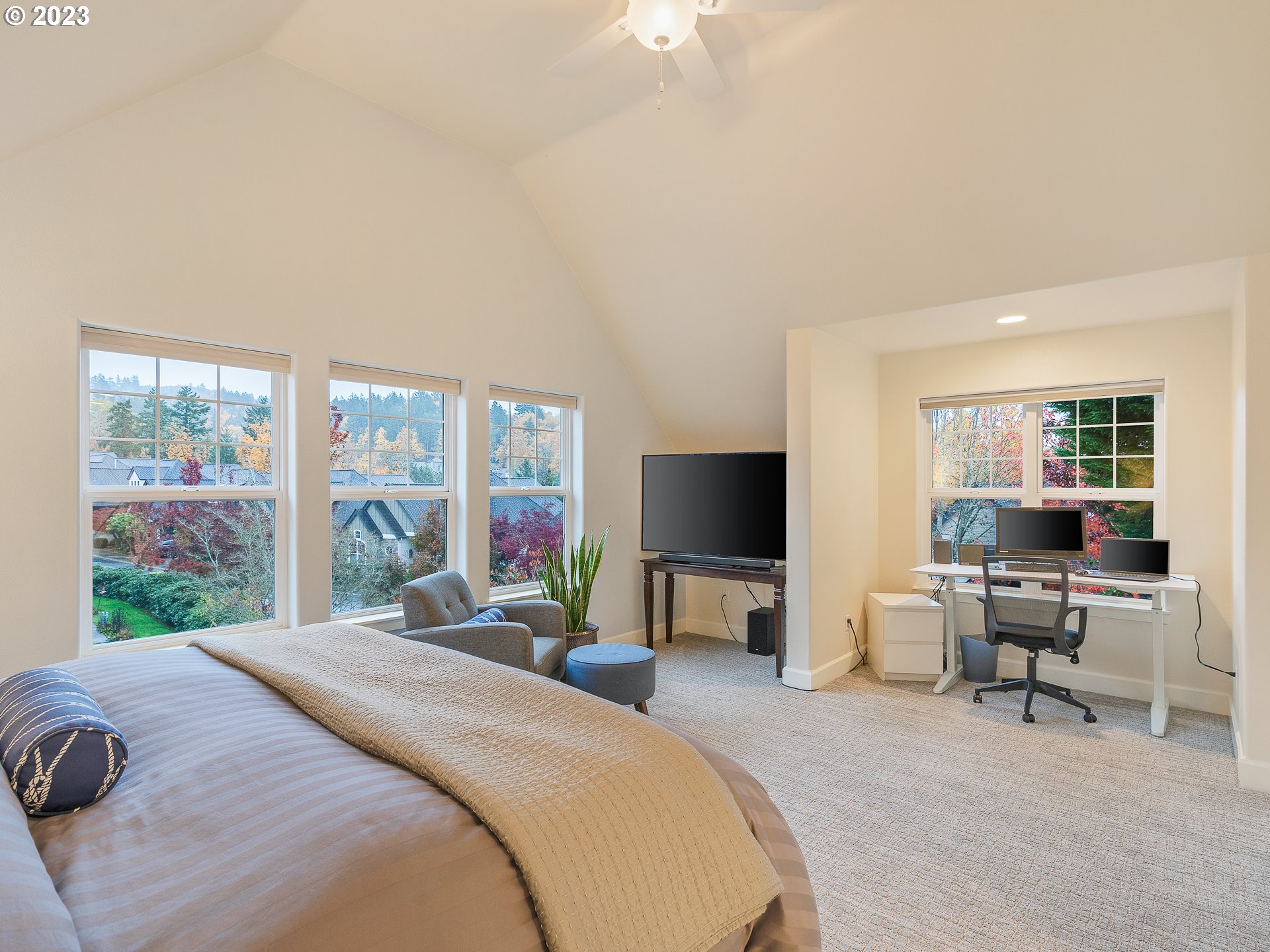 2306 Northwest Miller Road Portland, OR 97229 - Photo 25 of 46 a bedroom with a bed and a flat screen tv