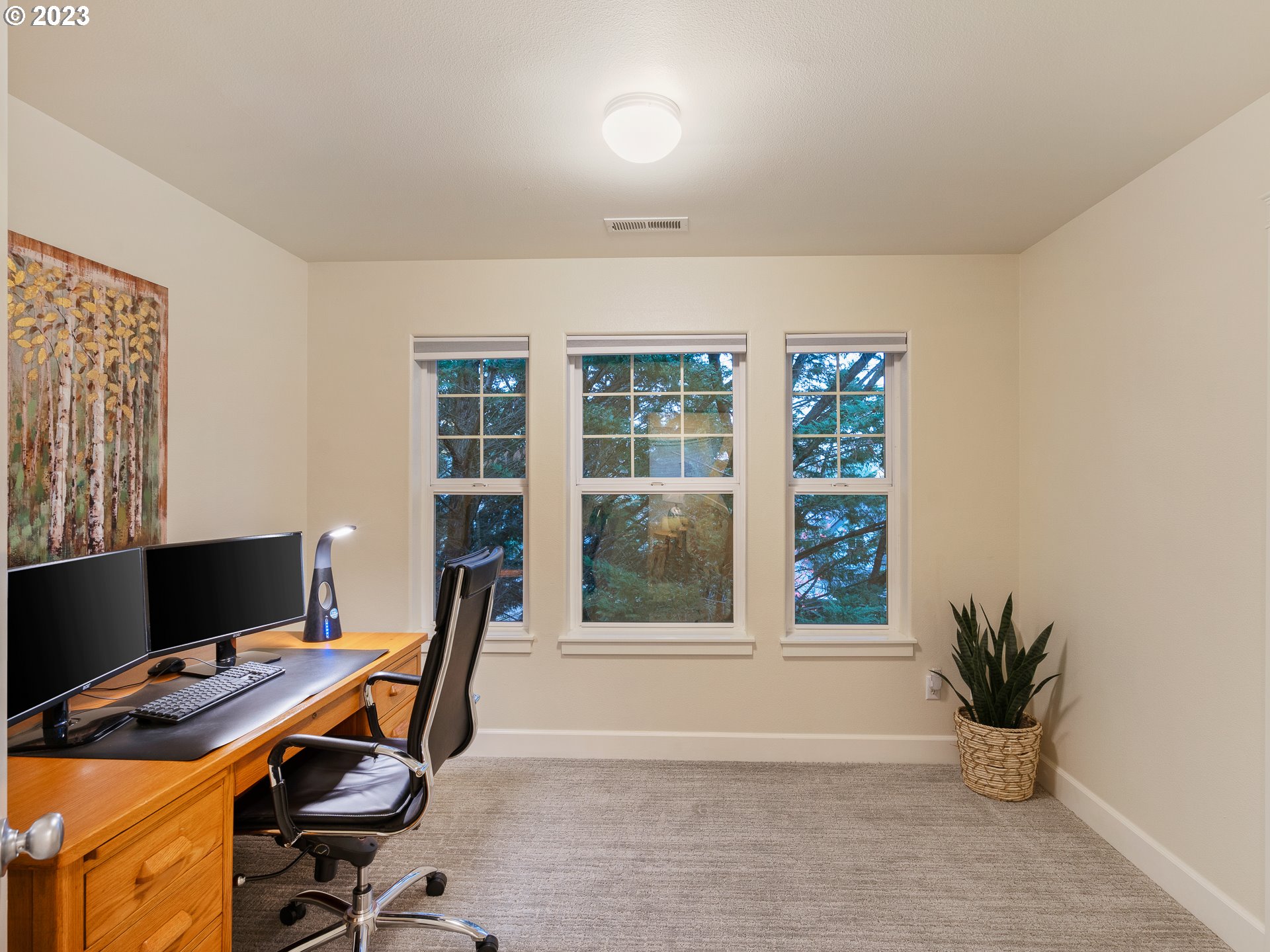 2306 Northwest Miller Road Portland, OR 97229 - Photo 32 of 46 a view of a workspace with furniture and a window