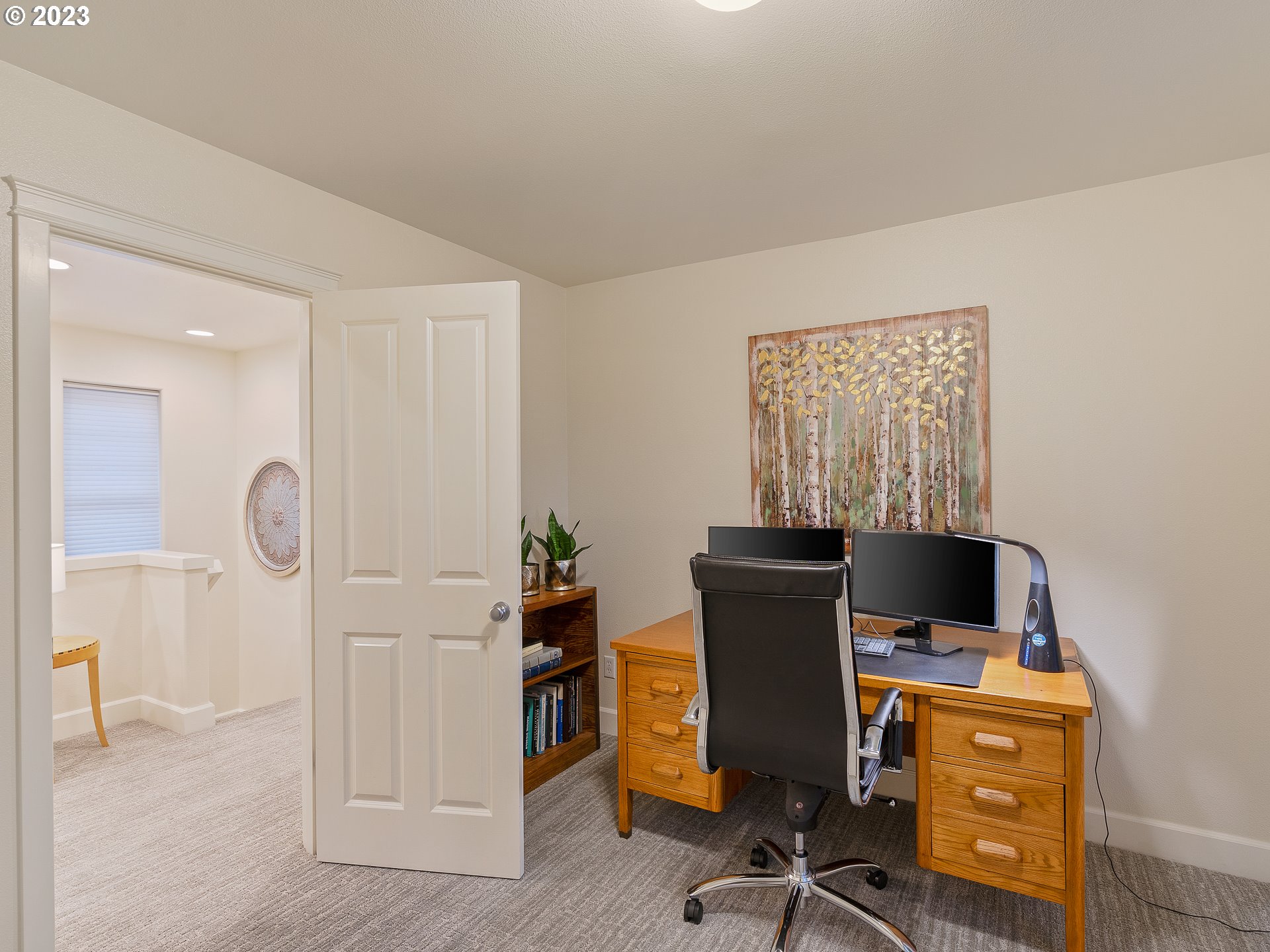 2306 Northwest Miller Road Portland, OR 97229 - Photo 33 of 46 a view of a workspace with furniture and a window