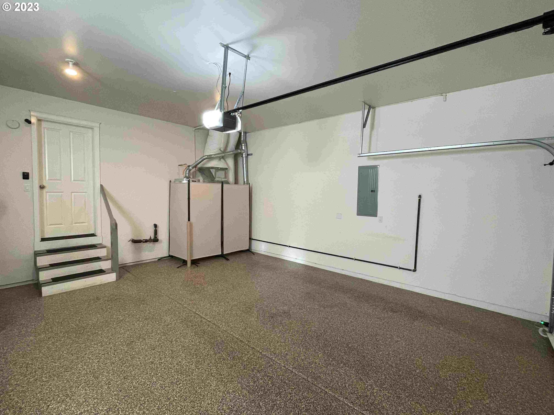 2306 Northwest Miller Road Portland, OR 97229 - Photo 36 of 46 a view of a room with stairs and a ceiling fan