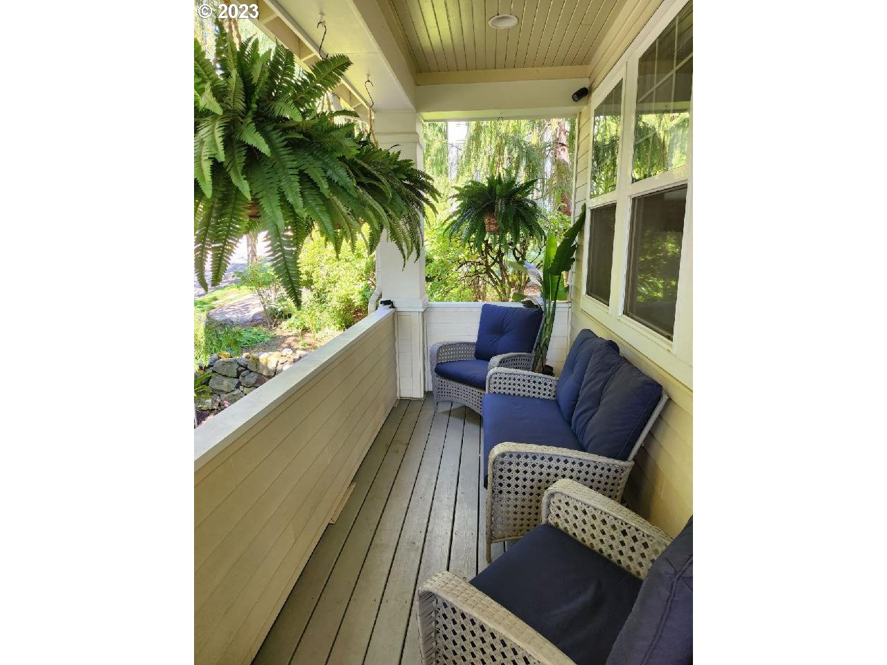 2306 Northwest Miller Road Portland, OR 97229 - Photo 6 of 46 a balcony with furniture and a potted plant