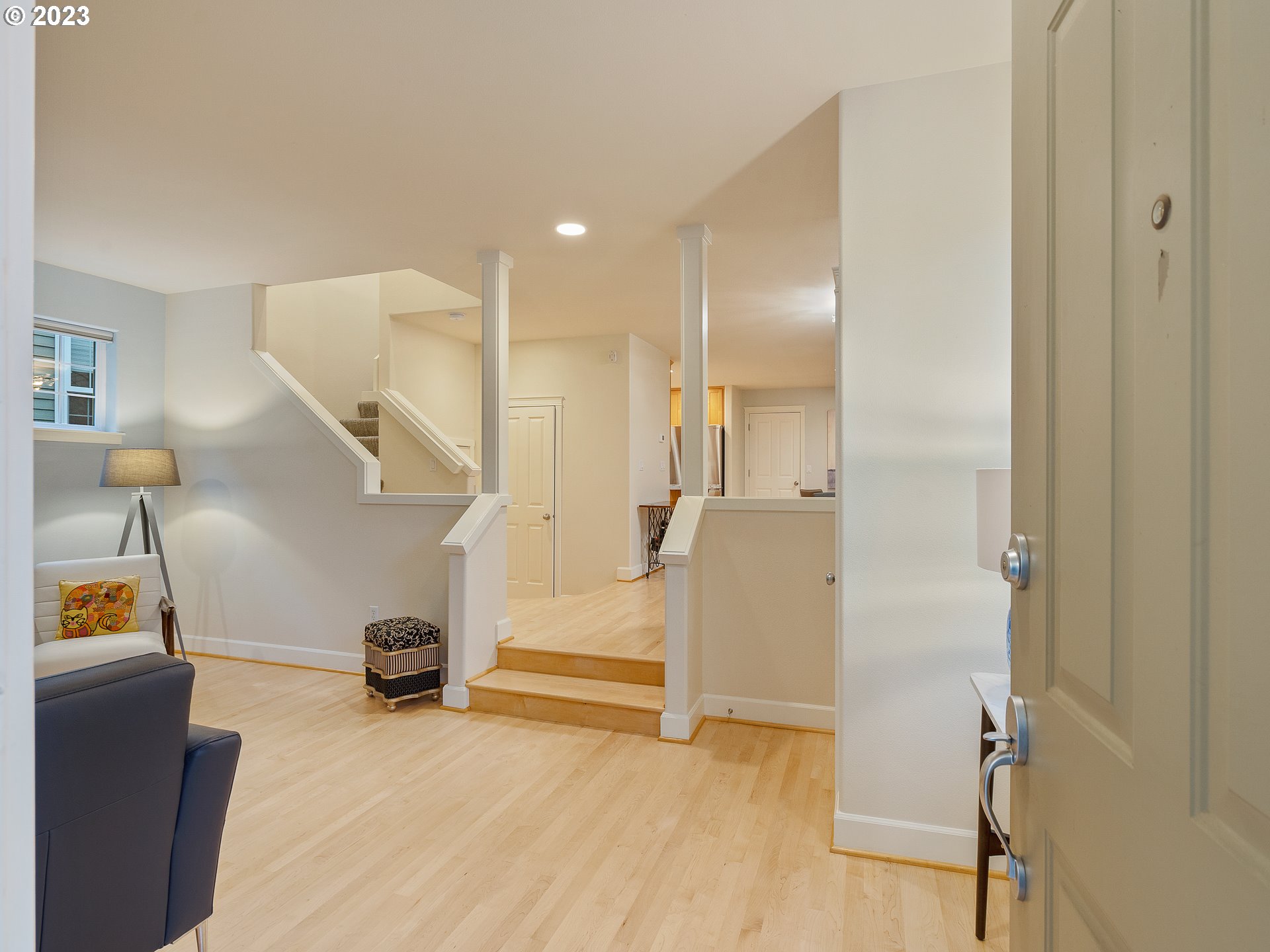 2306 Northwest Miller Road Portland, OR 97229 - Photo 7 of 46 a view of a livingroom with wooden floor and stairs