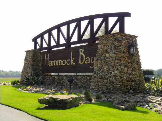 46 Nelly Street Freeport, FL 32439 - Photo 2 of 21 a sign of golf club on a wall