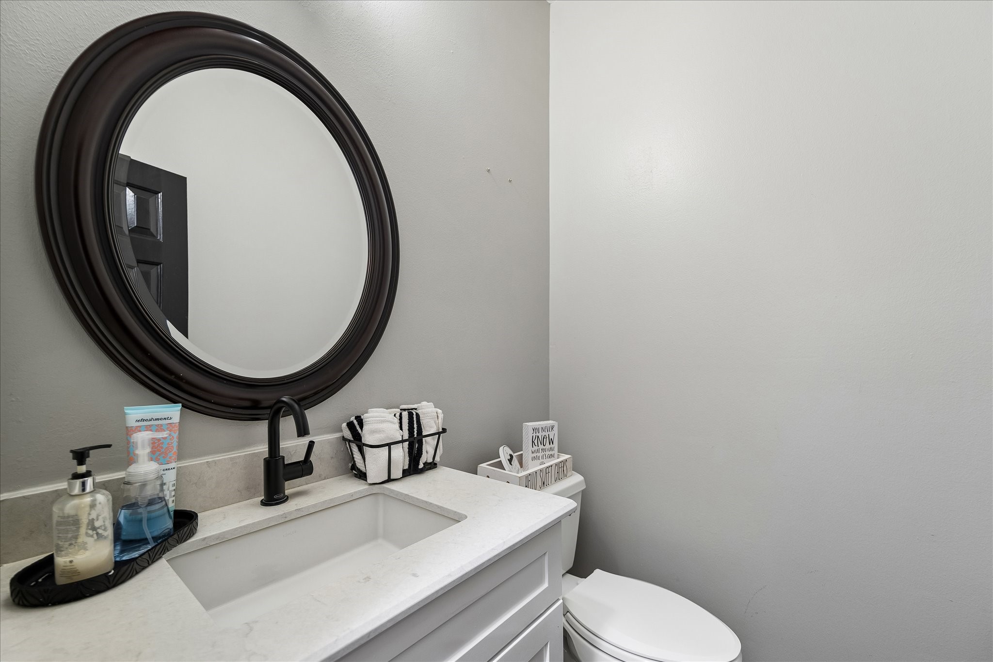 23039 Enchanted Landing Lane Katy, TX 77494 - Photo 16 of 30 a bathroom with a sink and a mirror