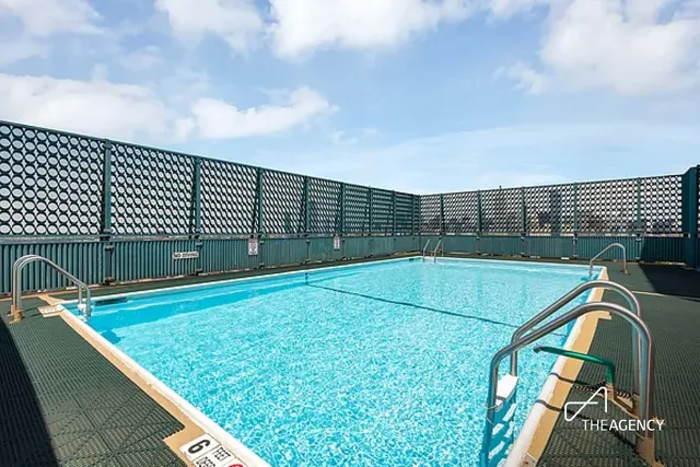 a view of a terrace with chairs and potted plants