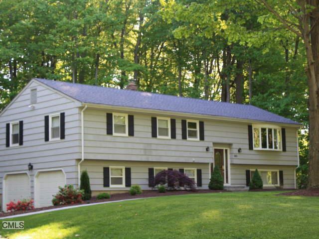 380 Dayton Road Trumbull, CT 06611 - Photo 1 of 1 a front view of a house with a garden and yard