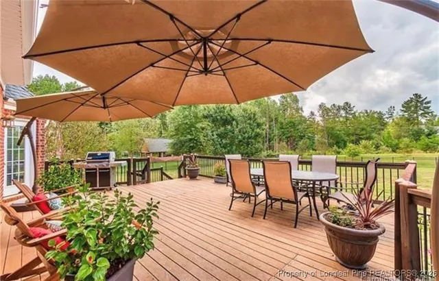 a view of a patio with furniture and yard