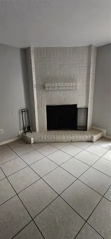 a living room with a fireplace
