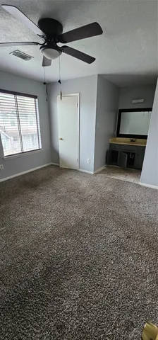 a view of a livingroom with a dishwasher and a window
