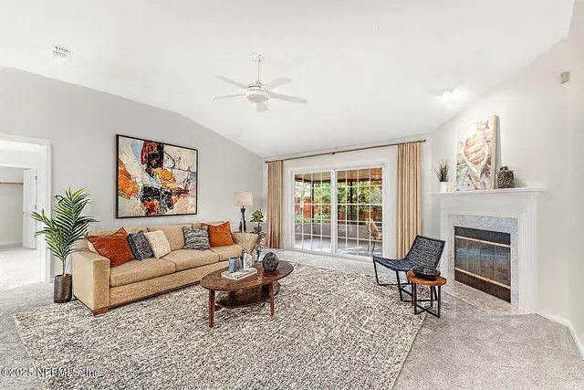 a view of a dining room with furniture and window