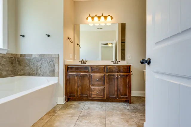 a bathroom with a bathtub and a sink