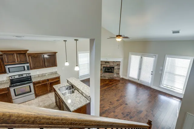 a view of living room with furniture and a flat screen tv