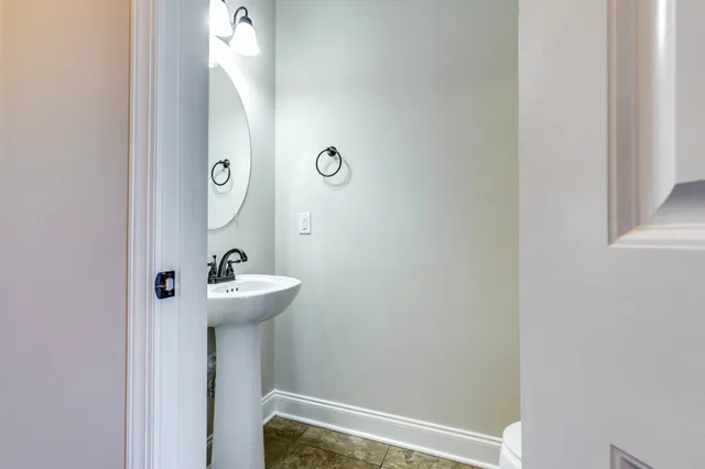 a bathroom with a sink and mirror