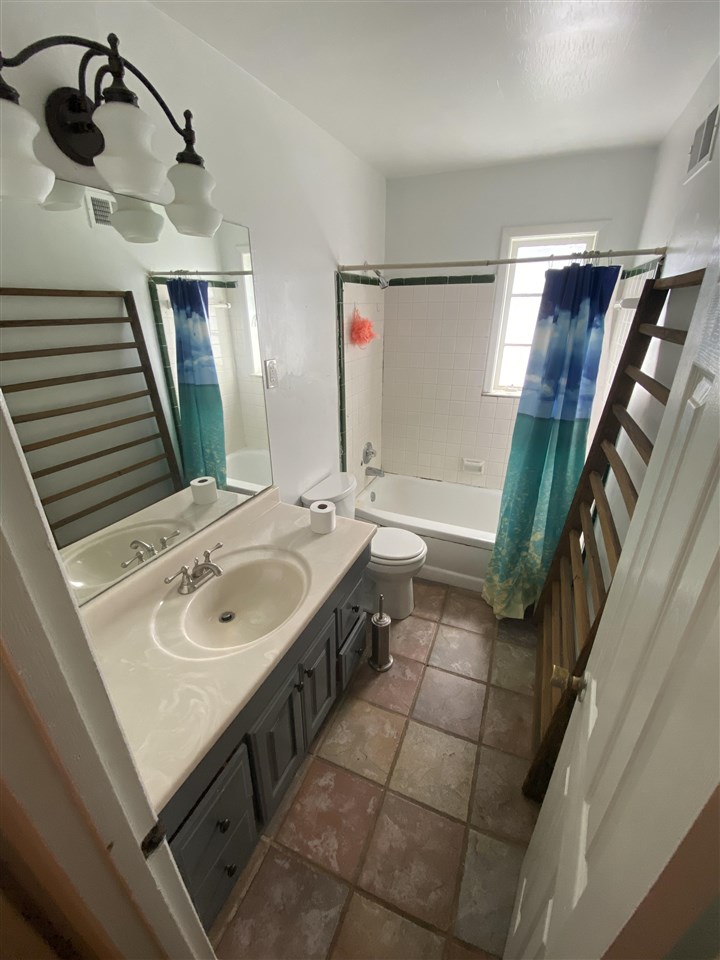 3814 Prescott Road Memphis, TN 38118 - Photo 13 of 22 a bathroom with a sink a toilet and mirror