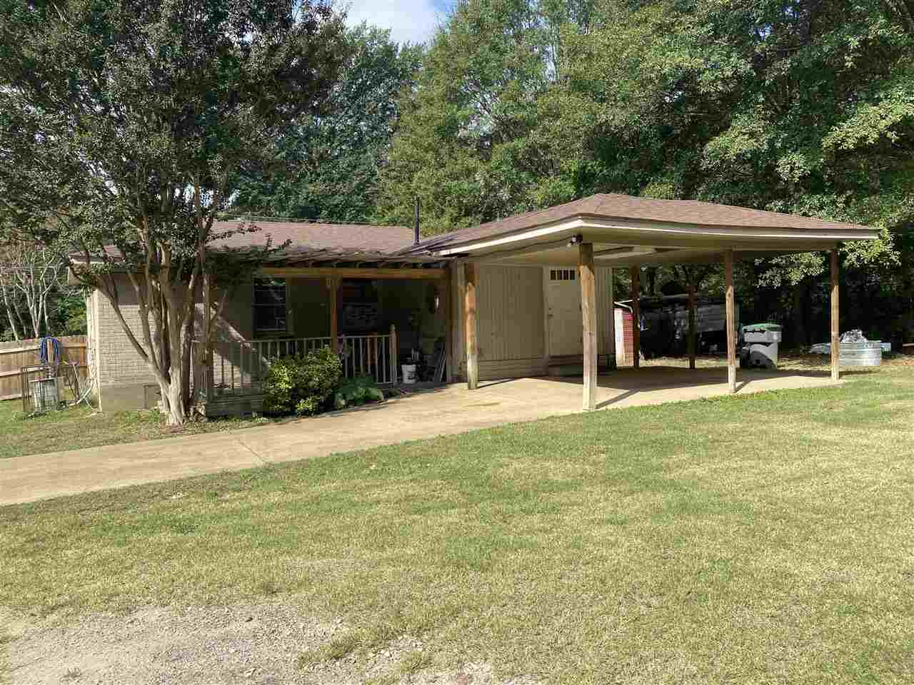 3814 Prescott Road Memphis, TN 38118 - Photo 20 of 22 a front view of a house with a garden