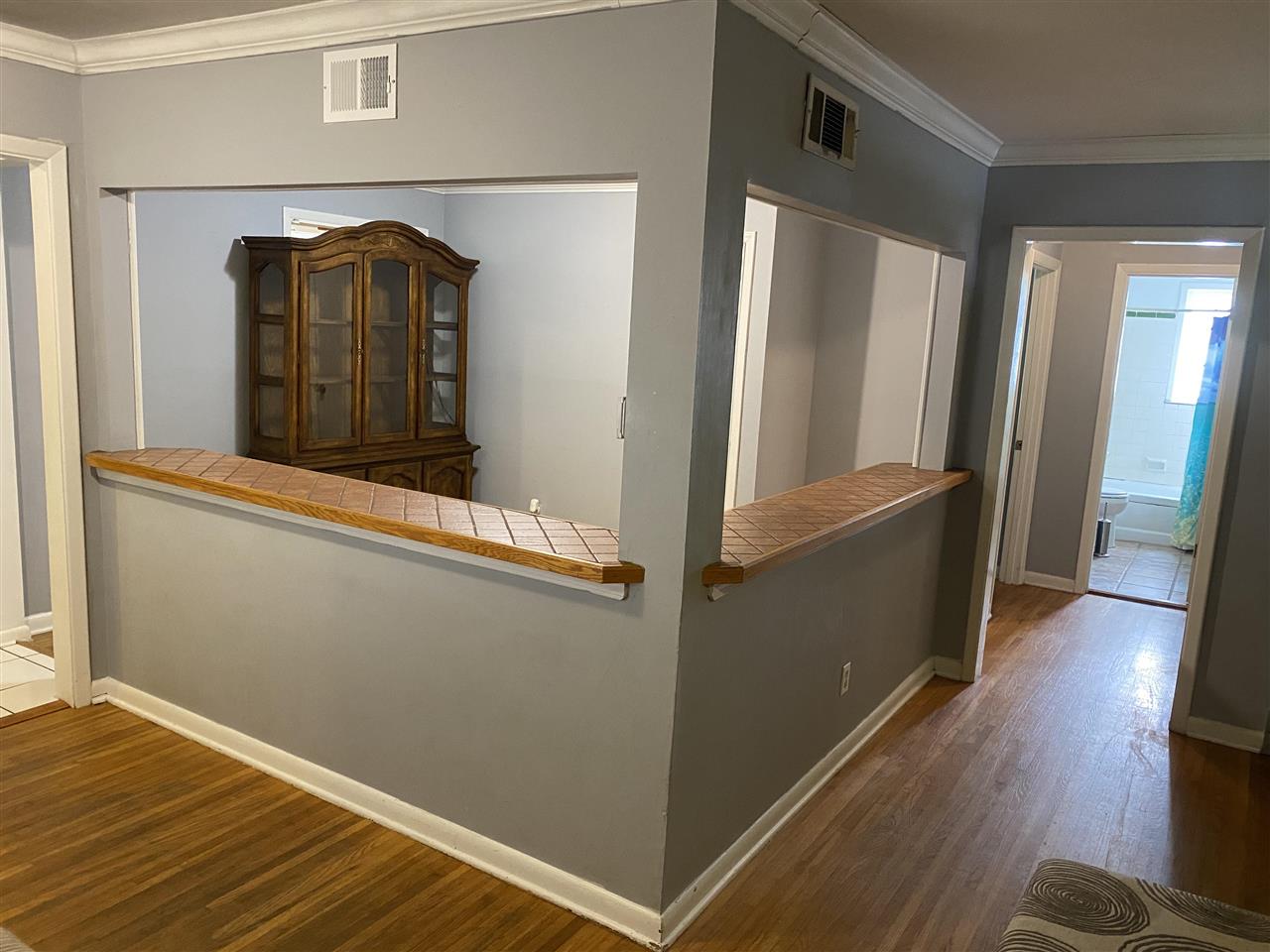 3814 Prescott Road Memphis, TN 38118 - Photo 6 of 22 a view of a hallway with wooden floor