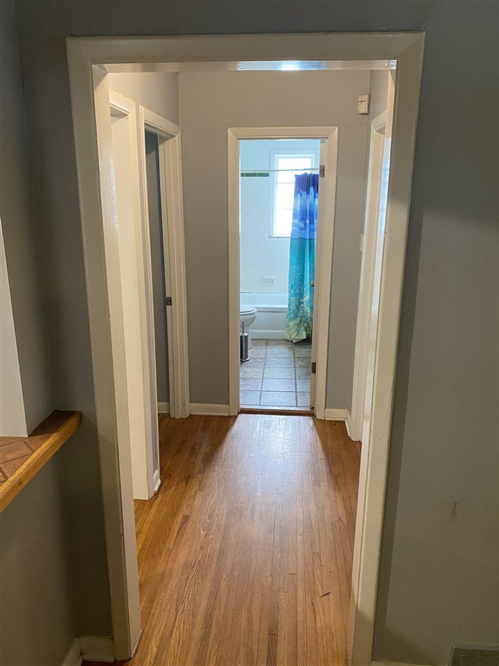 3814 Prescott Road Memphis, TN 38118 - Photo 10 of 22 a view of a hallway with wooden floor