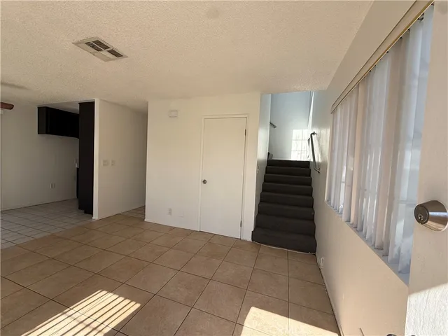 a view of a kitchen with an empty room