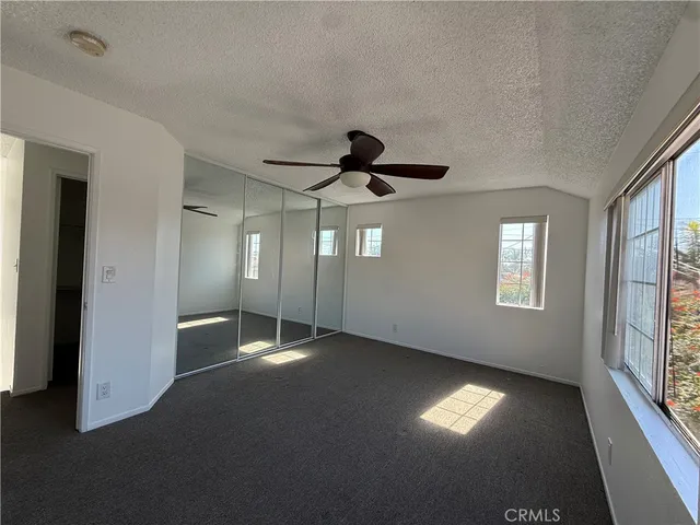 a bathroom with a double vanity sink toilet and mirror
