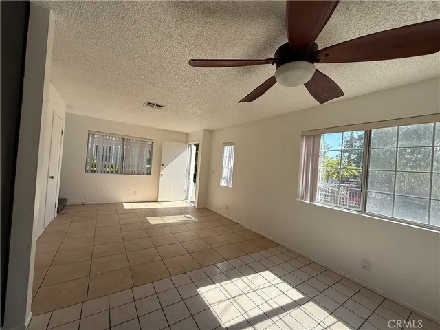 a kitchen with a sink window and cabinets