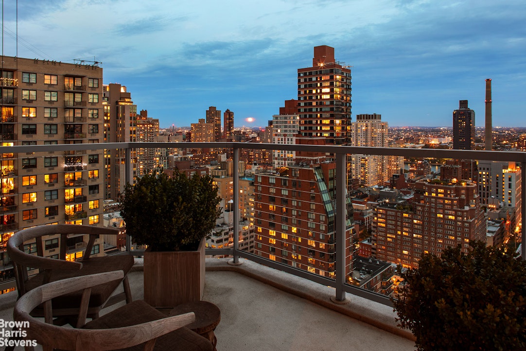 300 East 74th Street, Unit 30AB Manhattan, NY 10021 - Photo 11 of 17 a view of a balcony with wooden floor