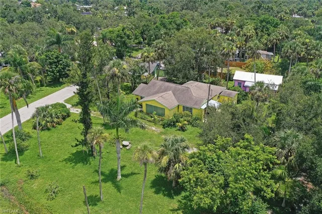 an aerial view of a house with yard and outdoor space