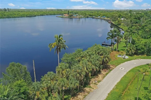 an aerial view of a houses with a lake view