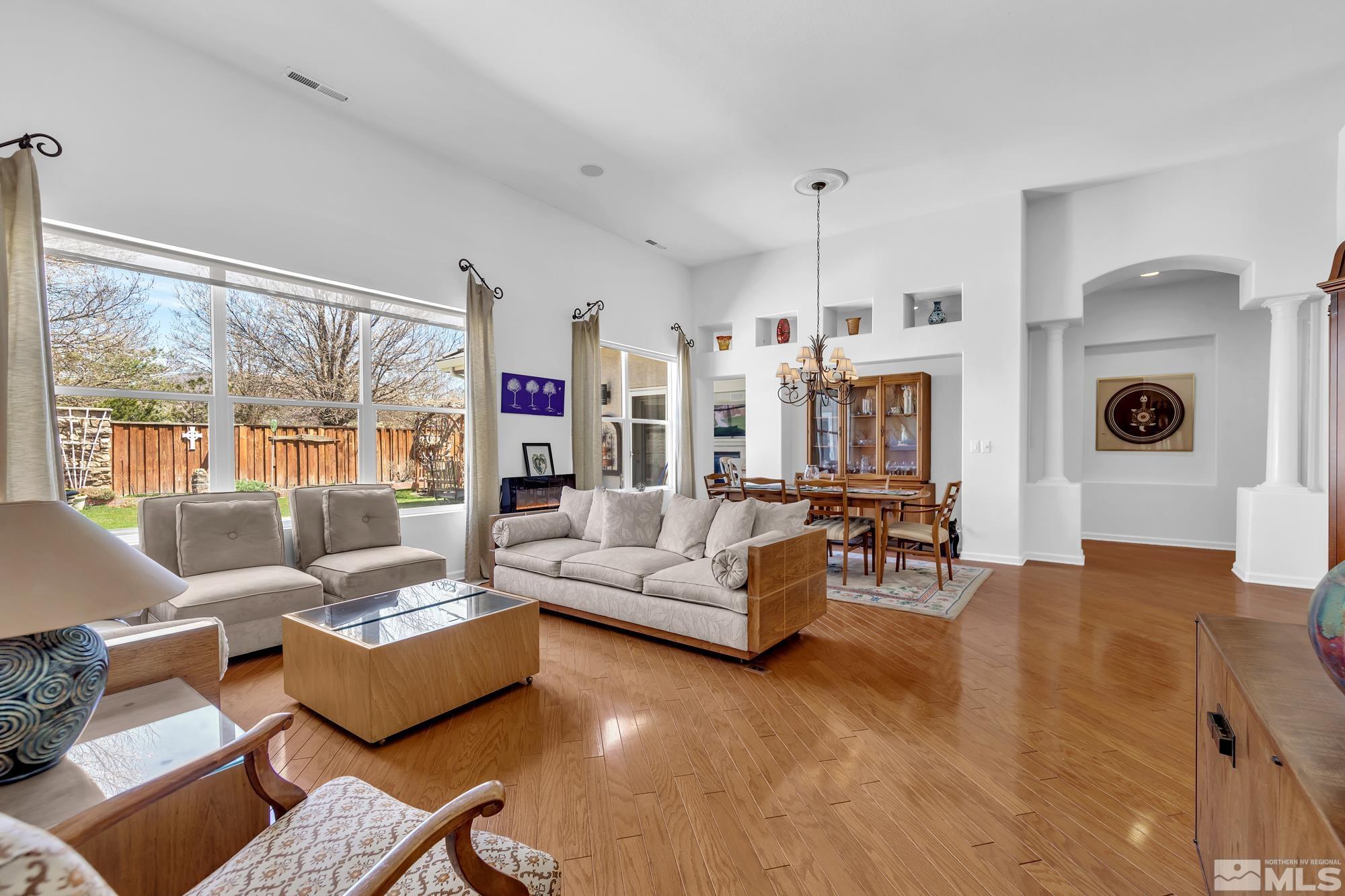 9638 Shadowstone Way Reno, NV 89521 - Photo 13 of 40 a living room with furniture and a large window