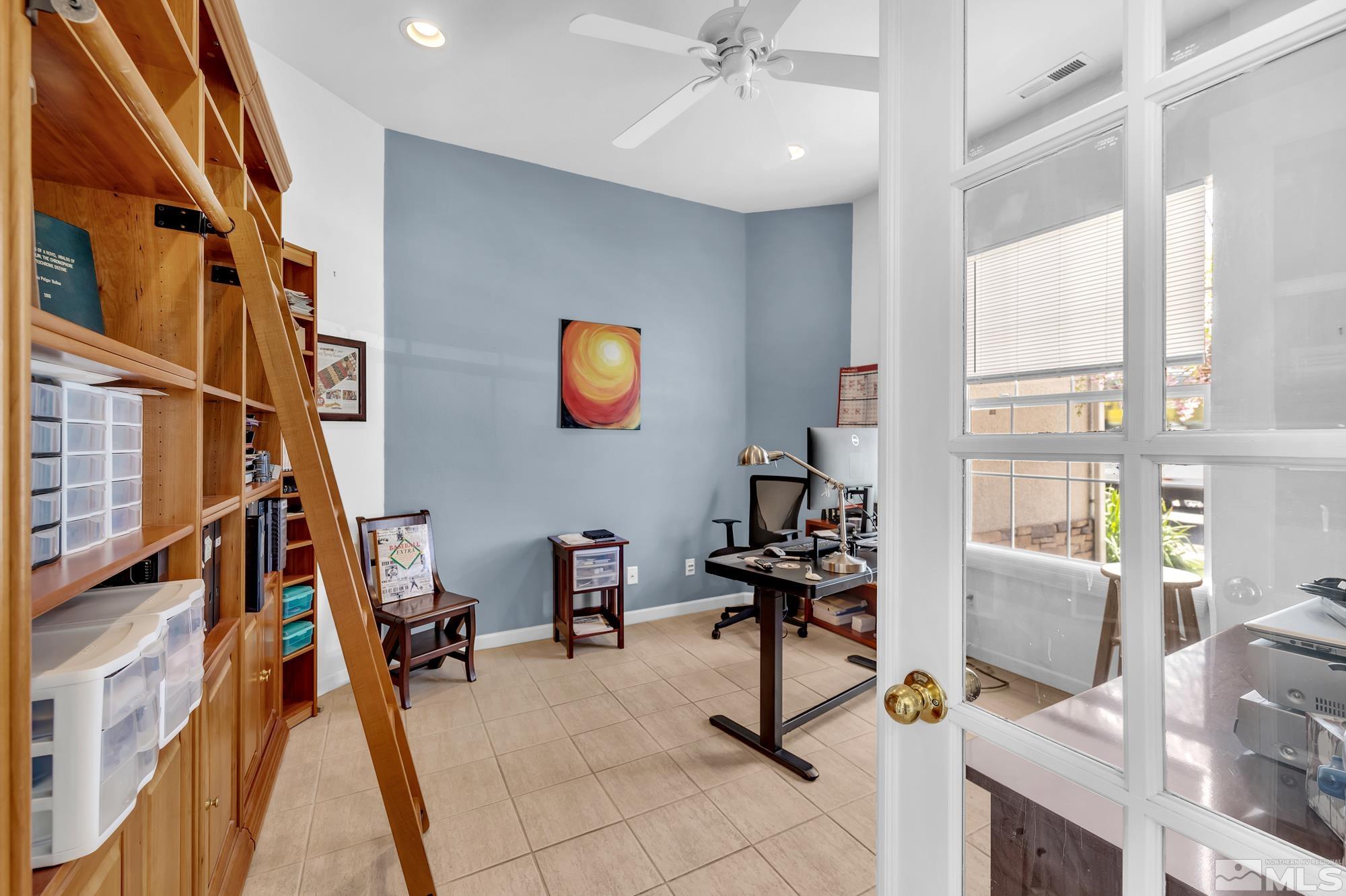 9638 Shadowstone Way Reno, NV 89521 - Photo 14 of 40 a view of a workspace with furniture and a window